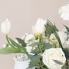 Grace and Beauty! This pristine mixed arrangement of white flowers like Tulips