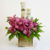 Handsome. Tropics-meets-Northwoods. 

An unexpected pairing of tropical Cymbidium or Phaleanopsis orchid cut