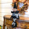 This charming old fashioned witch gnome is sure to put a spell