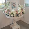 Wreath for picture frame with height on one side. Flowers and color