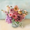 This gorgeous arrangement is small but has all the prettiest colors of
