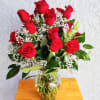 Share Joy Share flowers.
Beautiful red roses accented with some seasonal fresh foliage