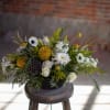 Large scale round centerpiece designs created in and 11 inch bowl. Floral