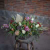 Large scale round centerpiece designs created in and 11 inch bowl. Floral