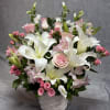 A soft and soothing mix of white lilies, pink roses, spray roses