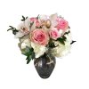 A delightful assortment of roses, carnations, orchids, and hydrangea in pastel springtime