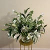 White lilies and other garden booms in neutral shades of green and