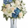 This majestic bouquet includes blue hydrangea, white asiatic lilies, white alstroemeria, light