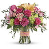 Go ahead, make them blush! This luxurious bouquet of roses, lilies and