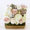 Beautifully designed arrangement in a 7&quot;X 7&quot; square wood box with ivory
