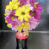 fresh flowers on a 8oz  coca cola   