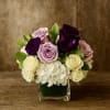  Lavender Charm is a breathtaking floral arrangement that blends soft romance
