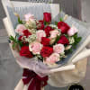 A luxurious and romantic holiday arrangement, made with the freshest red and
