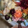 Flowers: burgundy dahlias, white garden roses, burgundy ranunculus, coral garden roses, lsiainthus