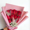 Red roses wrapped in pink paper, beautiful and perfect for a surprise