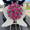 Life size angel wings w/ deluxe rose spray makes a perfect addition