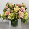 This sweet arrangement will be composed of beautiful peachy pink, bright green