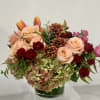 Low and lush holiday arrangement fit for a feast! Gorgeous hydrangea, large