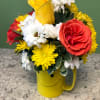 A cheerful arrangement designed to brighten any day, featuring vibrant orange roses