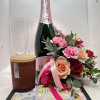 Beautiful adorned bottle of bubbles with flowers perfect to celebrate your love