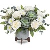 Inspired by tranquil clouds, this elegant bouquet of white blooms and varying