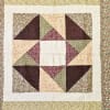 This eye-catching quilt is beautiful. Gorgeous patterns and embroidery, perfect for a