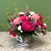 A charming seasonal arrangement presented in a keepsake teacup and saucer. Featuring