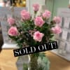 One Dozen Beautifully Arranged Pink Roses In Glass Vase With Fillers And