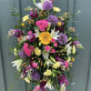 Our Easle Spray is fully customizable in colors and flowers. Easle Sprays