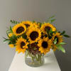 Sunflowers and greens make this arrangement fabulous!  Clear vase, 
order 24/7
Delivery