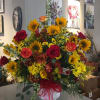 The Crisp Colors of Fall Urn Arrangement will make the perfect tribute