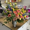 Beautiful and Delicate floral arrangement in spring colors!! Roses, chrysanthemums, alstroemerias, dolphins