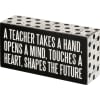 Box Sign- A Teacher takes a hand.
Measures 6&quot;x3&quot;