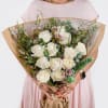 A gorgeous wrapped bouquet designed with premium 1 Dozen White Roses, Wax