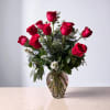 The classic. One dozen stunning long stemmed roses arranged with an assortment