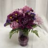 A beautiful arrangement of fabulous purples, certain to put a smile on