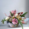 Silk and Dry Flowers arrangement wit hornatments in a plaster pot.