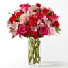 Blushing shades of pink blooms are nestled in lush greens to charm