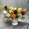 This elegant mix colors roses urn arrangement features striking mix colors roses