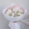 A delicate blend of soft blush roses, ranunculus, and hydrangea wrapped in