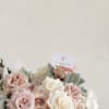 A soft blend of white and beige roses, offering timeless elegance&mdash;perfect for
