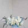 A soft and elegant floral gift to celebrate a precious baby boy.