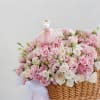 A sweet blend of soft pink and white blooms, styled in a