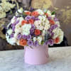 Brighten any space with our Elegant Flower Box Arrangement! Bursting with vibrant
