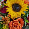 This arrangement is designed in an Autumn decorative vase. It will consist