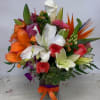 A bouquet of mixed tropical flowers in bright colors in a square