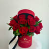 Elegant and timeless, this arrangement showcases velvety red roses surrounded by lush