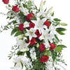 This easel display a lovely arrangement of White oriental lilys and red