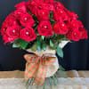 A beautiful bouquet of red roses with sparkling rhinestones, wrapped in burlap