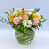 A beautiful display of Peach, Blush and Yellow colored flowers in a